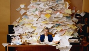 Office Worker with Mountain of Paperwork